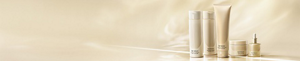 Hair care line displayed on a soft golden-beige backdrop in warm lighting